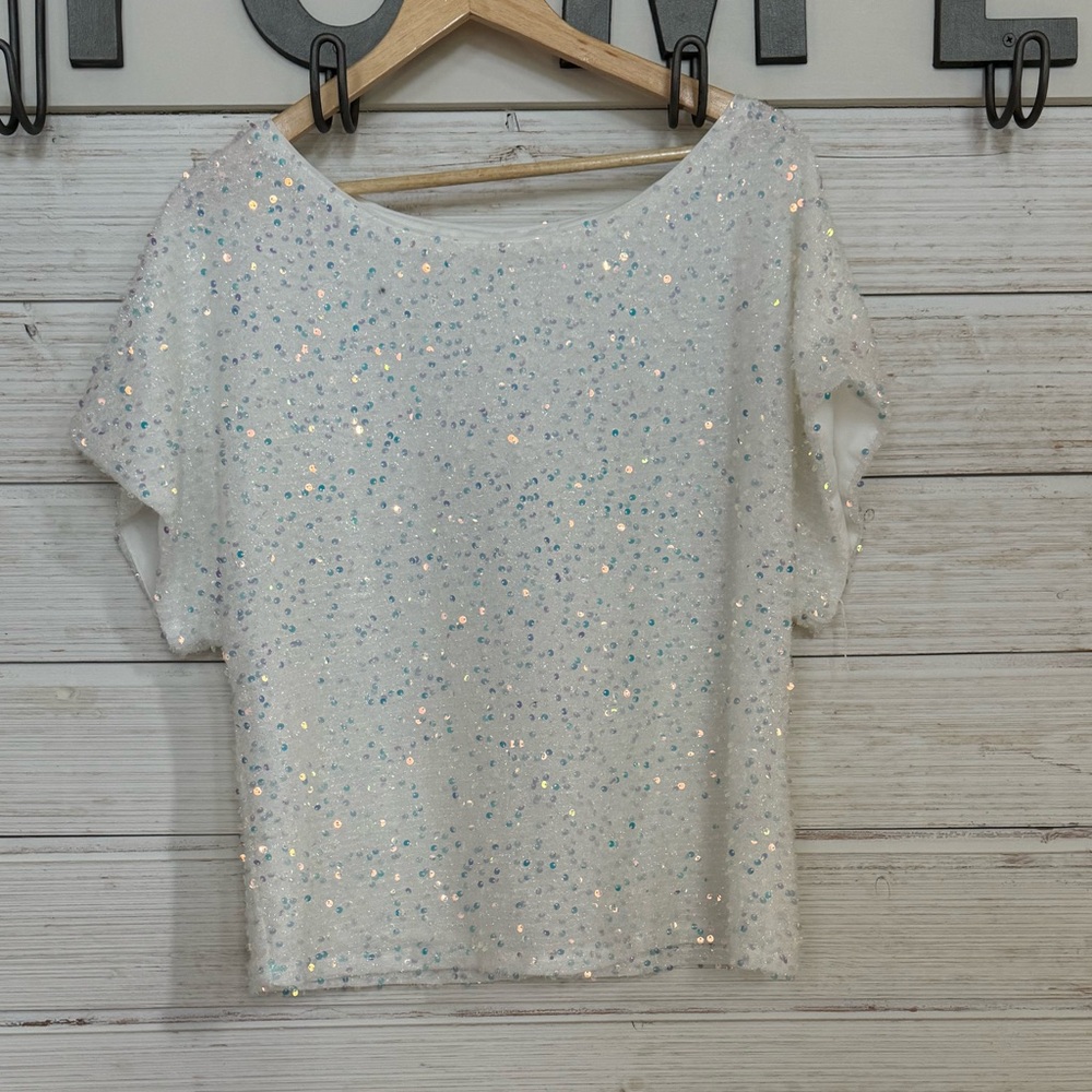 Iridescent sequence loose fitting top.
